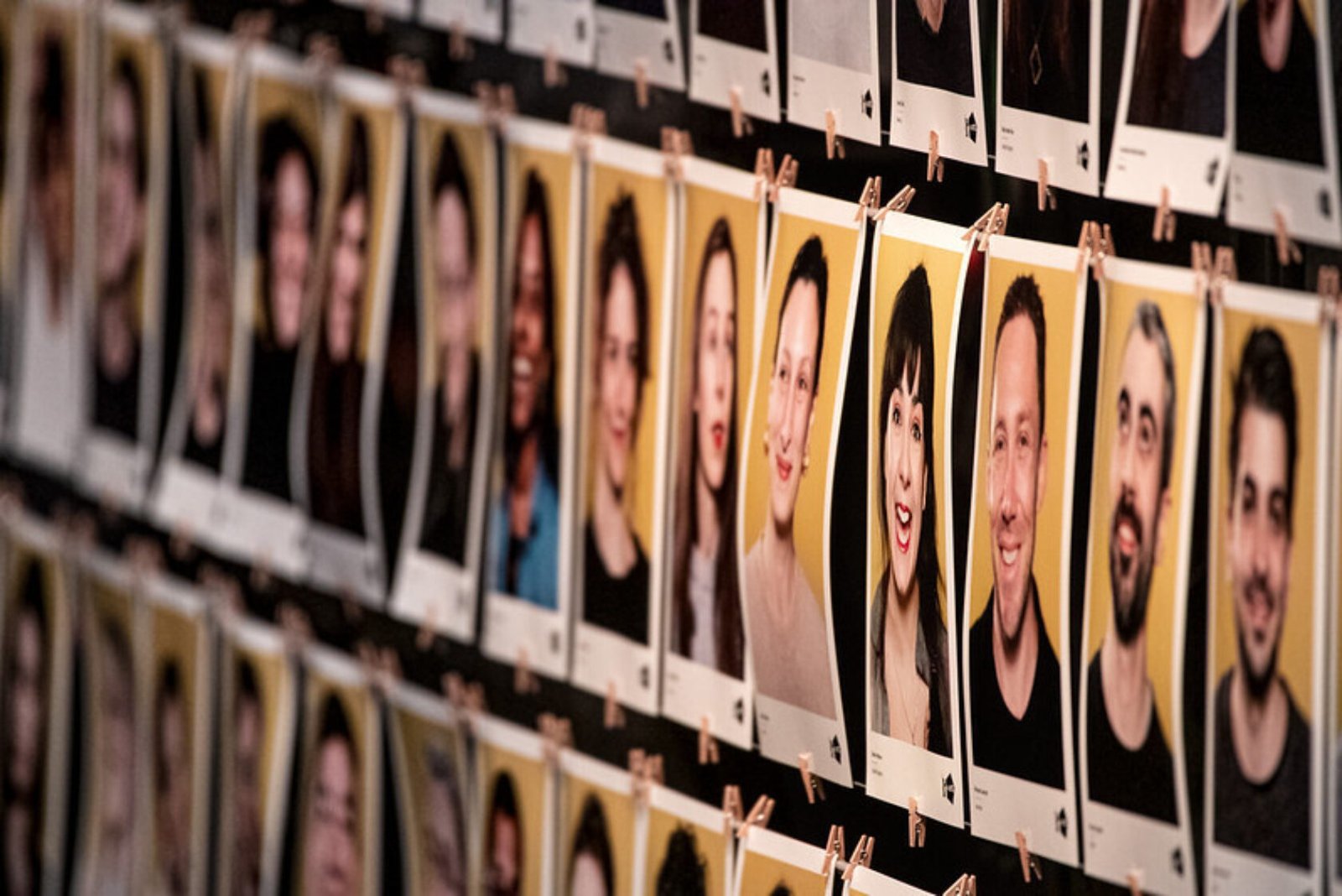 Rows of photographs with people's faces